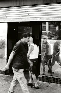 a group of people walking down the street