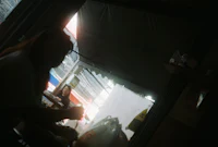 a woman sitting at a table in a restaurant